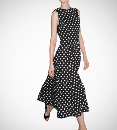 Black dress with white polka dots worn by a model on a white zara style long maxi sleeveless new year outfit holidays sexy women's clothing love bonito crew neck asian fit korean style clothing online shopping 