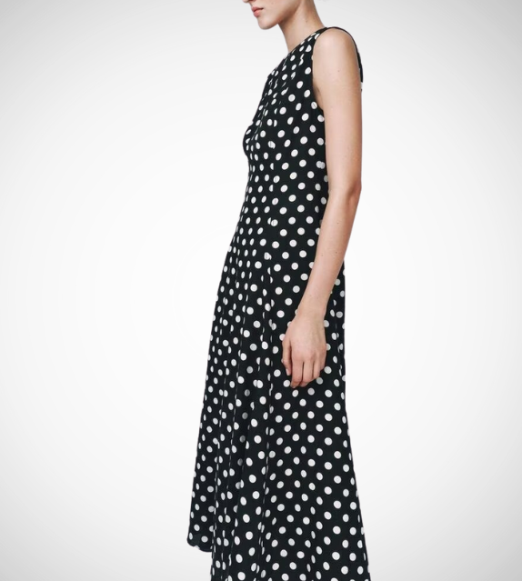 Black dress with white polka dots worn by a model on a white zara style long maxi sleeveless new year outfit holidays sexy women's clothing love bonito crew neck asian fit korean style clothing online shopping 