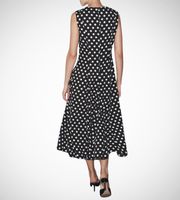 Black dress with white polka dots worn by a model on a white zara style long maxi sleeveless new year outfit holidays sexy women's clothing love bonito crew neck asian fit korean style clothing online shopping 