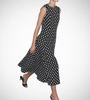Black dress with white polka dots worn by a model on a white zara style long maxi sleeveless new year outfit holidays sexy women's clothing love bonito crew neck asian fit korean style clothing online shopping 