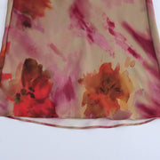 Floral dress with a knot detail on a white background zara tie die style short sleeves mutli-color wedding holidays special occassion dresses women's clothing love bonito uniqlo h&m shein what to wear outifit ootd fashion 