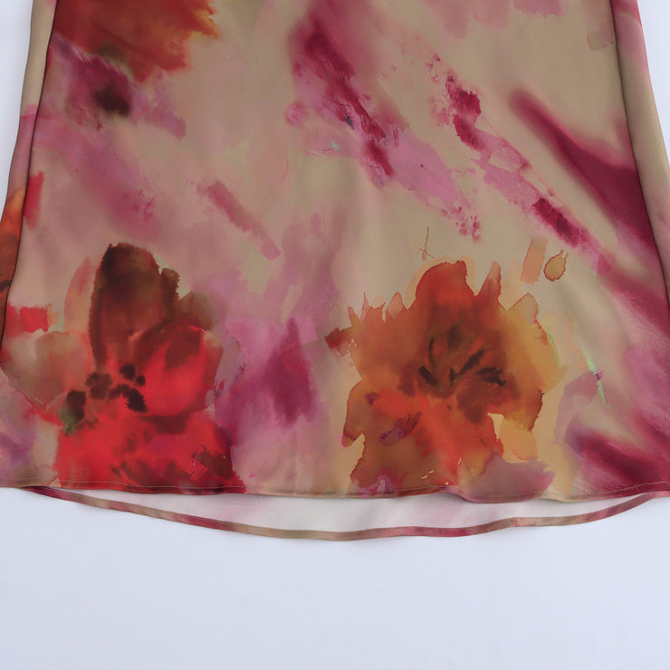 Floral dress with a knot detail on a white background zara tie die style short sleeves mutli-color wedding holidays special occassion dresses women's clothing love bonito uniqlo h&m shein what to wear outifit ootd fashion 