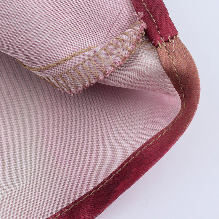 Floral dress with a knot detail on a white background zara tie die style short sleeves mutli-color wedding holidays special occassion dresses women's clothing love bonito uniqlo h&m shein what to wear outifit ootd fashion 