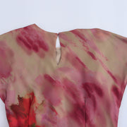 Floral dress with a knot detail on a white background zara tie die style short sleeves mutli-color wedding holidays special occassion dresses women's clothing love bonito uniqlo h&m shein what to wear outifit ootd fashion 