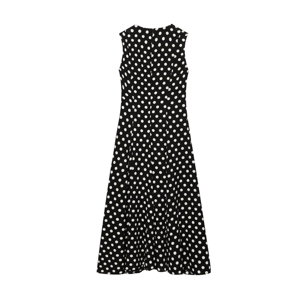 Black dress with white polka dots worn by a model on a white zara style long maxi sleeveless new year outfit holidays sexy women's clothing love bonito crew neck asian fit korean style clothing online shopping 