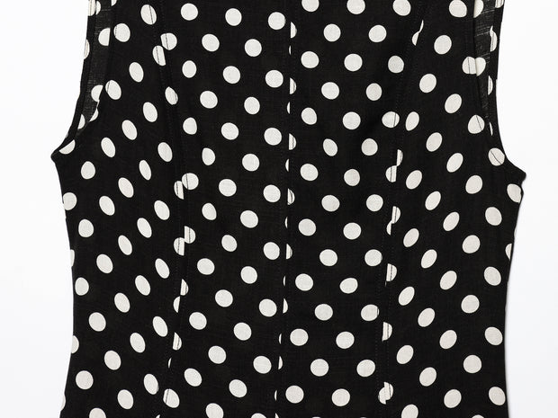 Black dress with white polka dots worn by a model on a white zara style long maxi sleeveless new year outfit holidays sexy women's clothing love bonito crew neck asian fit korean style clothing online shopping 