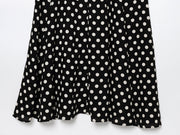 Black dress with white polka dots worn by a model on a white zara style long maxi sleeveless new year outfit holidays sexy women's clothing love bonito crew neck asian fit korean style clothing online shopping 