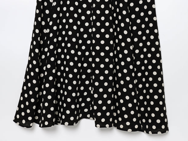 Black dress with white polka dots worn by a model on a white zara style long maxi sleeveless new year outfit holidays sexy women's clothing love bonito crew neck asian fit korean style clothing online shopping 
