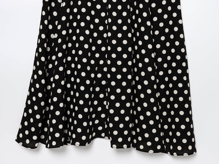 Black dress with white polka dots worn by a model on a white zara style long maxi sleeveless new year outfit holidays sexy women's clothing love bonito crew neck asian fit korean style clothing online shopping 