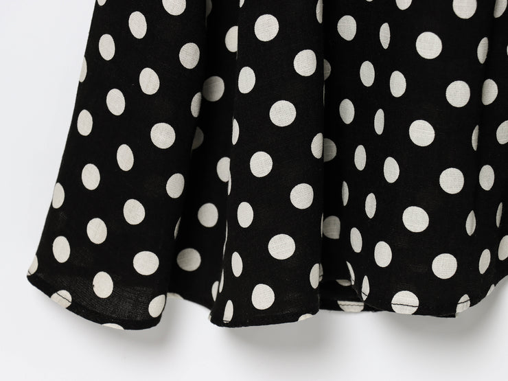 Black dress with white polka dots worn by a model on a white zara style long maxi sleeveless new year outfit holidays sexy women's clothing love bonito crew neck asian fit korean style clothing online shopping 