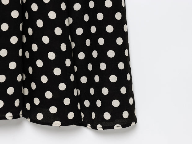 Black dress with white polka dots worn by a model on a white zara style long maxi sleeveless new year outfit holidays sexy women's clothing love bonito crew neck asian fit korean style clothing online shopping 