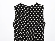 Black dress with white polka dots worn by a model on a white zara style long maxi sleeveless new year outfit holidays sexy women's clothing love bonito crew neck asian fit korean style clothing online shopping 