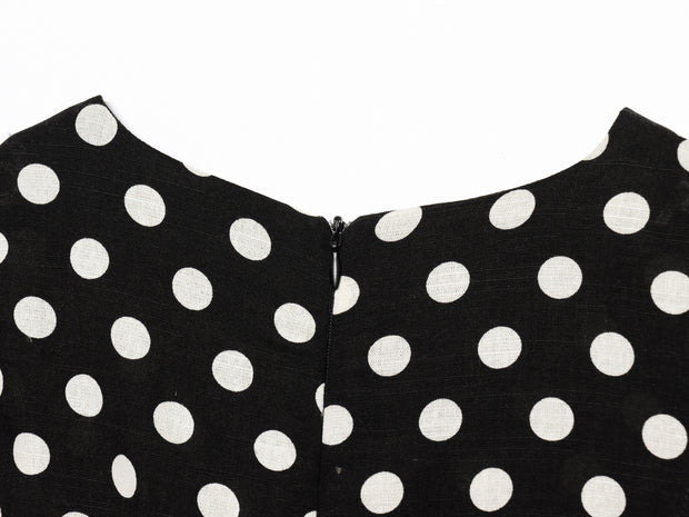 Black dress with white polka dots worn by a model on a white zara style long maxi sleeveless new year outfit holidays sexy women's clothing love bonito crew neck asian fit korean style clothing online shopping 