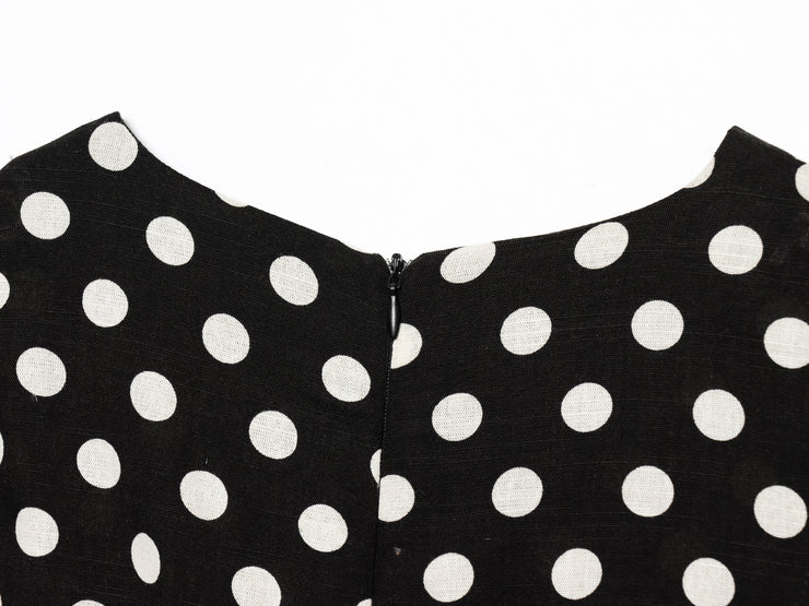 Black dress with white polka dots worn by a model on a white zara style long maxi sleeveless new year outfit holidays sexy women's clothing love bonito crew neck asian fit korean style clothing online shopping 