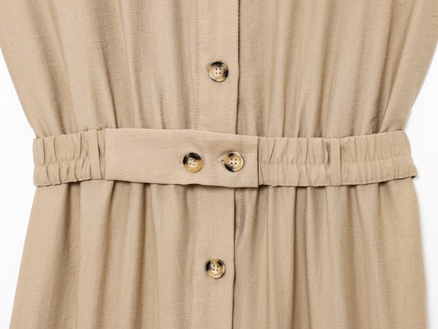 khaki women wearing a jumpsuit with side pockets uniqlo zara mango style online shopping sleeveless cargo utility wear cuff sleeves short belted waist gartered button down polo shirt everyday casual style classic wear ootd outfit must have trending 