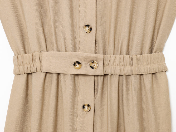 khaki women wearing a jumpsuit with side pockets uniqlo zara mango style online shopping sleeveless cargo utility wear cuff sleeves short belted waist gartered button down polo shirt everyday casual style classic wear ootd outfit must have trending 