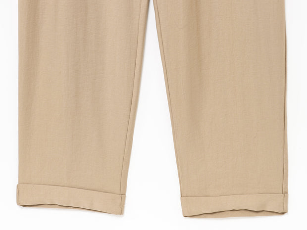 khaki women wearing a jumpsuit with side pockets uniqlo zara mango style online shopping sleeveless cargo utility wear cuff sleeves short belted waist gartered button down polo shirt everyday casual style classic wear ootd outfit must have trending 