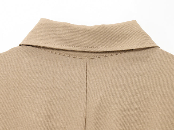 khaki women wearing a jumpsuit with side pockets uniqlo zara mango style online shopping sleeveless cargo utility wear cuff sleeves short belted waist gartered button down polo shirt everyday casual style classic wear ootd outfit must have trending 