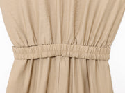 khaki women wearing a jumpsuit with side pockets uniqlo zara mango style online shopping sleeveless cargo utility wear cuff sleeves short belted waist gartered button down polo shirt everyday casual style classic wear ootd outfit must have trending 