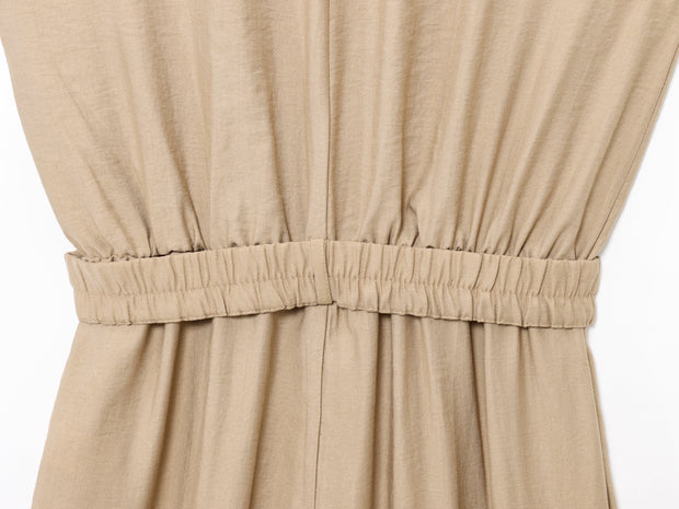 khaki women wearing a jumpsuit with side pockets uniqlo zara mango style online shopping sleeveless cargo utility wear cuff sleeves short belted waist gartered button down polo shirt everyday casual style classic wear ootd outfit must have trending 