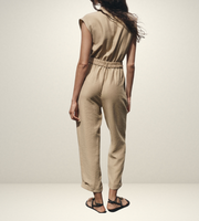 khaki women wearing a jumpsuit with side pockets uniqlo zara mango style online shopping sleeveless cargo utility wear cuff sleeves short belted waist gartered button down polo shirt everyday casual style classic wear ootd outfit must have trending 