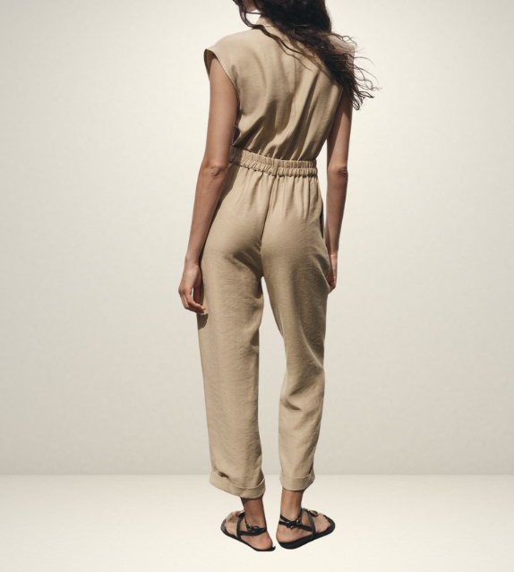 khaki women wearing a jumpsuit with side pockets uniqlo zara mango style online shopping sleeveless cargo utility wear cuff sleeves short belted waist gartered button down polo shirt everyday casual style classic wear ootd outfit must have trending 